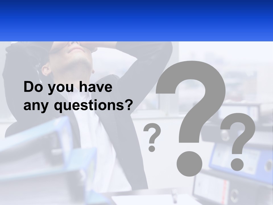 A Man Sitting At A Desk With His Head In His Hands PowerPoint Template