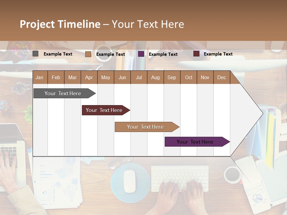A Group Of People Sitting At A Table Working On Laptops PowerPoint Template