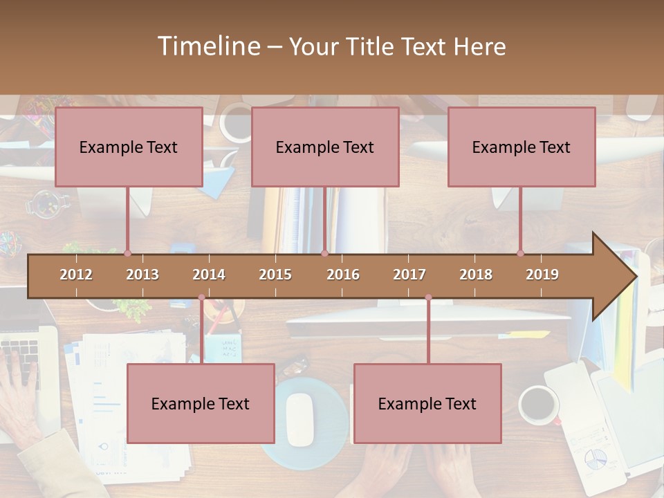 A Group Of People Sitting At A Table Working On Laptops PowerPoint Template