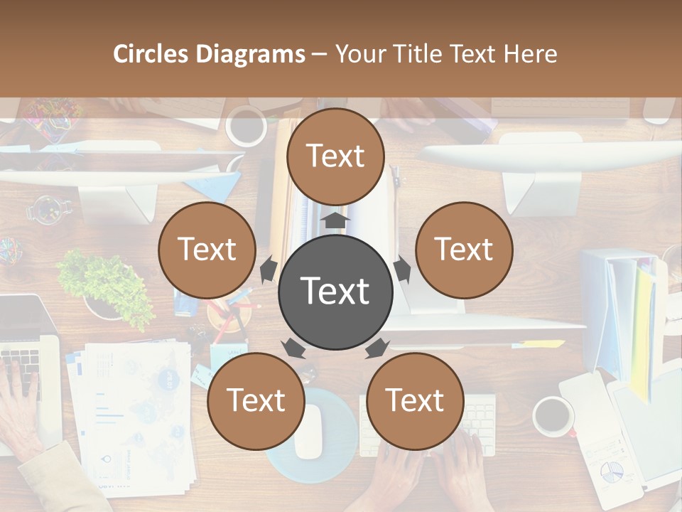 A Group Of People Sitting At A Table Working On Laptops PowerPoint Template