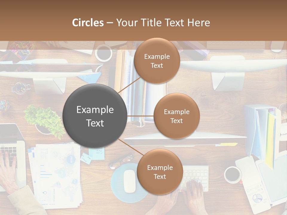 A Group Of People Sitting At A Table Working On Laptops PowerPoint Template