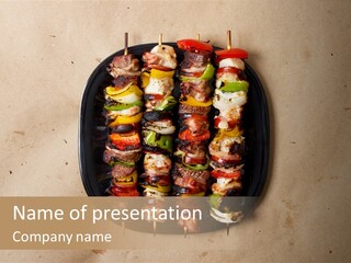 A Plate Of Skewered Meat And Vegetables On Skewers PowerPoint Template