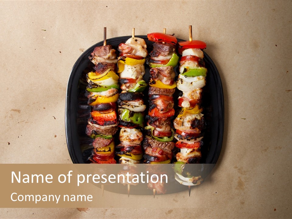 A Plate Of Skewered Meat And Vegetables On Skewers PowerPoint Template