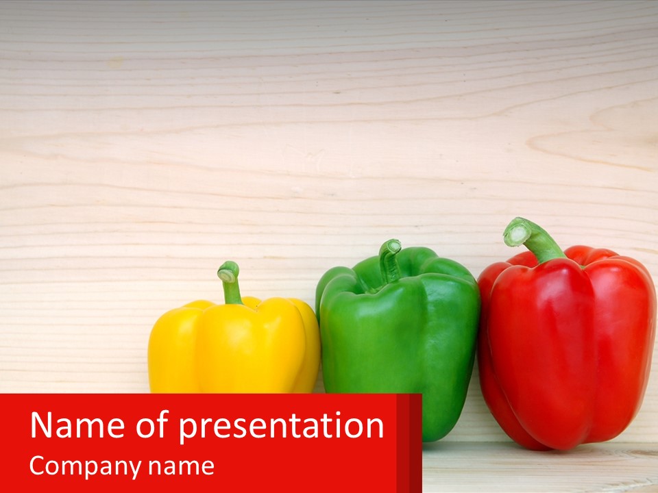 A Row Of Peppers Sitting On Top Of A Wooden Table PowerPoint Template