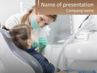 A Young Girl Getting Her Teeth Checked By A Dentist PowerPoint Template