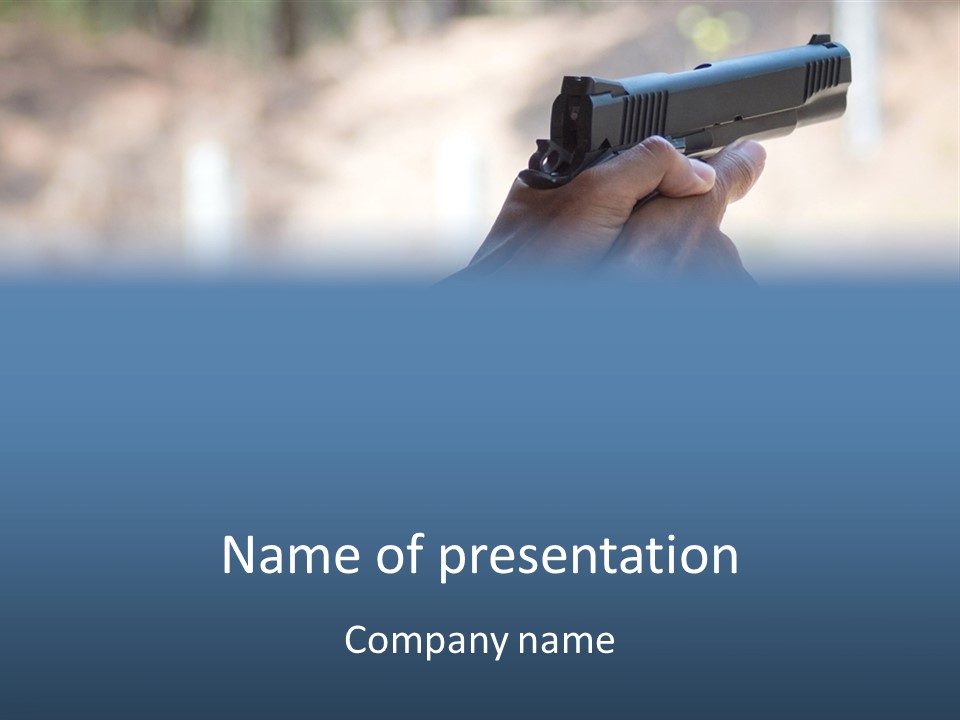 A Person Holding A Gun In Their Hand PowerPoint Template