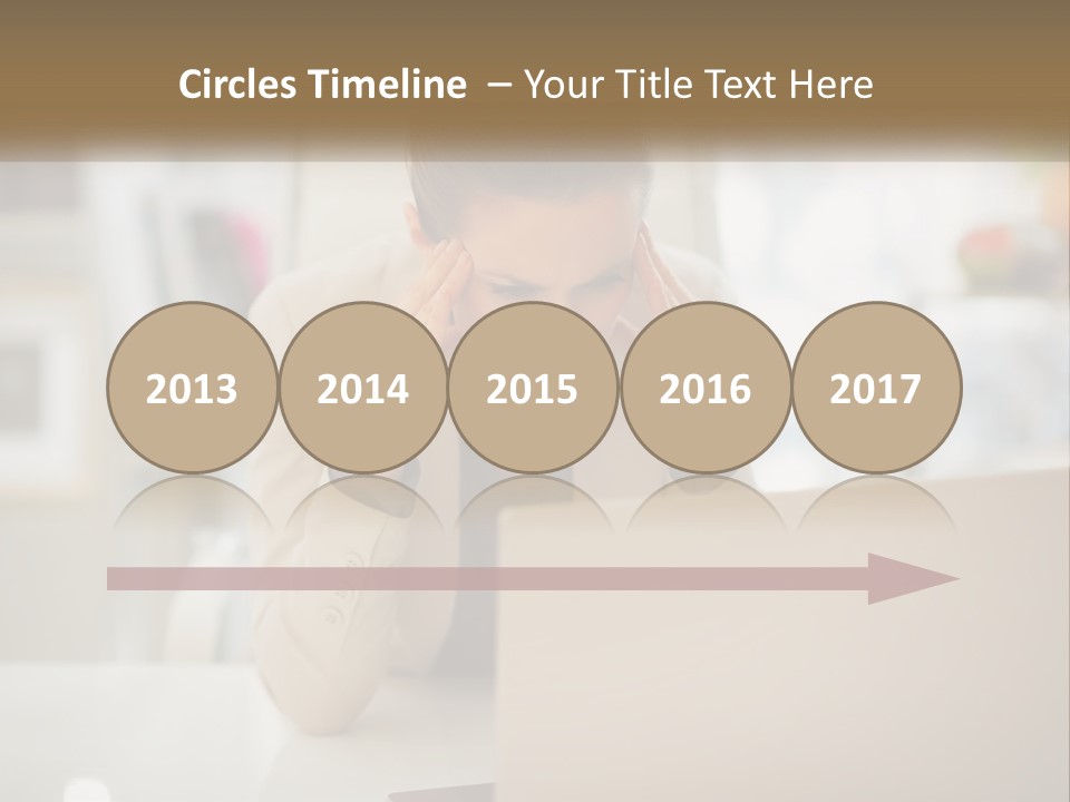 A Woman Sitting In Front Of A Laptop Computer PowerPoint Template