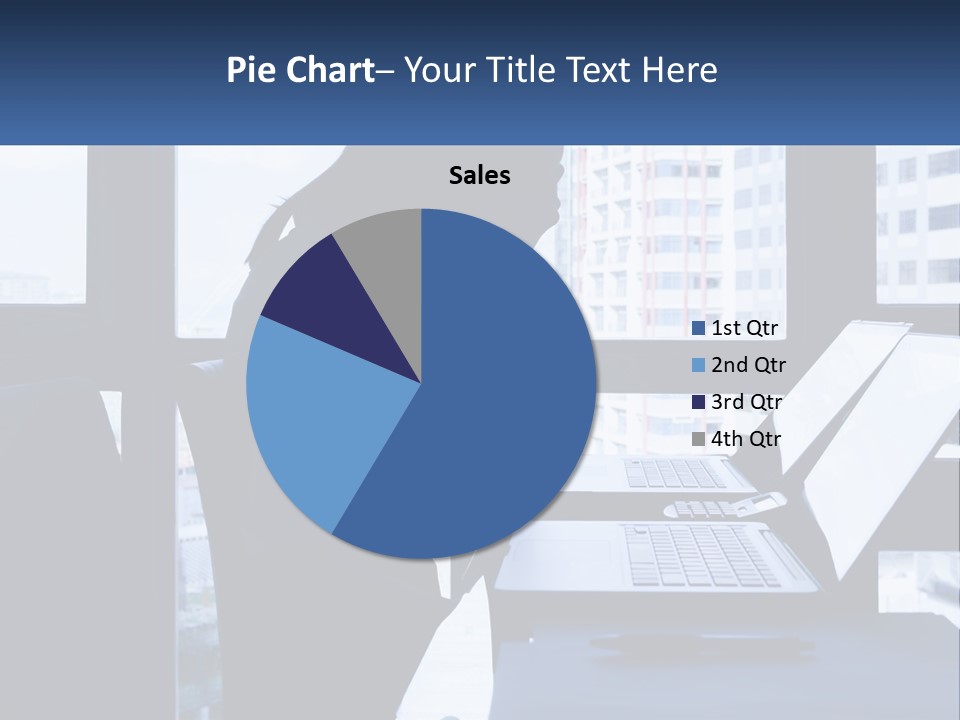 A Man Sitting In Front Of A Laptop Computer PowerPoint Template