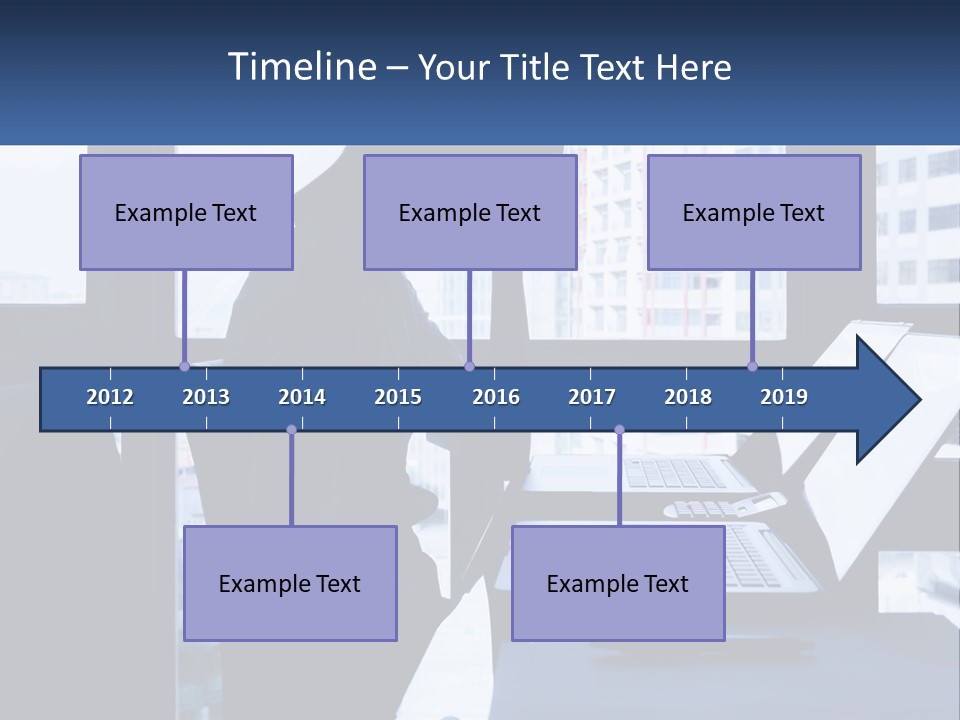 A Man Sitting In Front Of A Laptop Computer PowerPoint Template