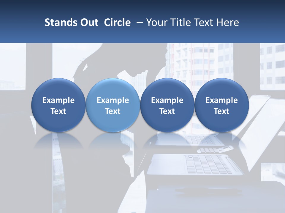 A Man Sitting In Front Of A Laptop Computer PowerPoint Template