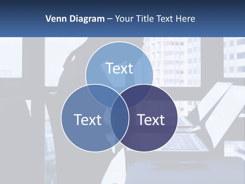 A Man Sitting In Front Of A Laptop Computer PowerPoint Template