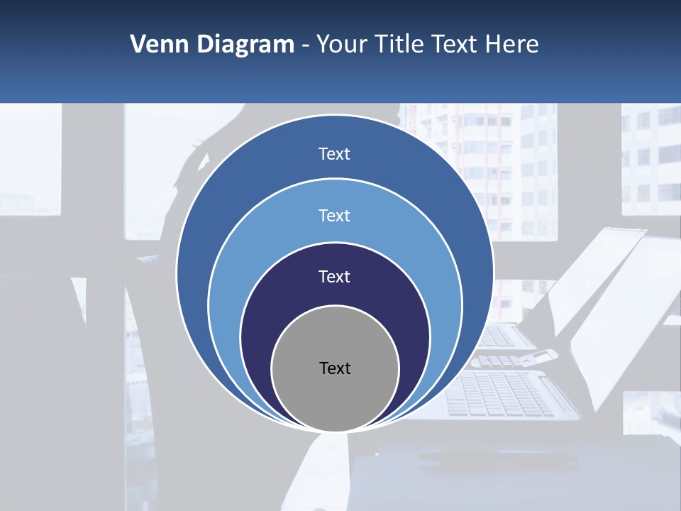 A Man Sitting In Front Of A Laptop Computer PowerPoint Template