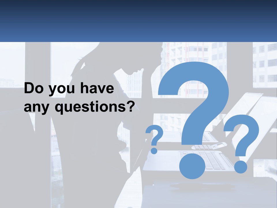 A Man Sitting In Front Of A Laptop Computer PowerPoint Template