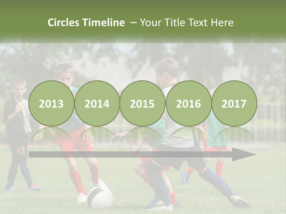 A Group Of Children Playing Soccer On A Field PowerPoint Template