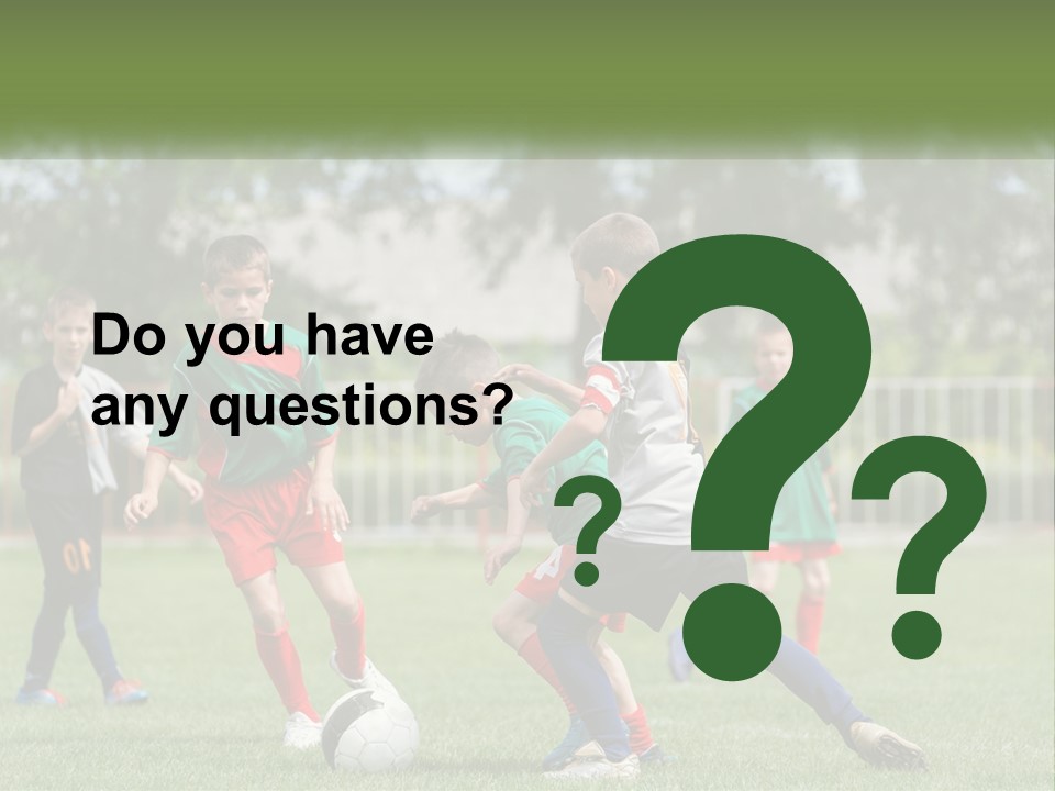 A Group Of Children Playing Soccer On A Field PowerPoint Template