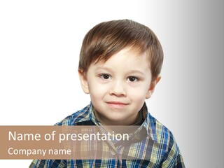 A Young Boy Is Smiling For The Camera PowerPoint Template