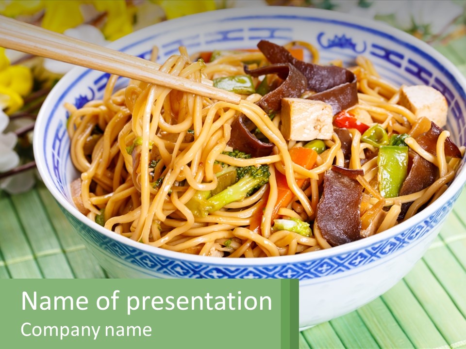A Blue And White Bowl Filled With Noodles And Vegetables PowerPoint Template