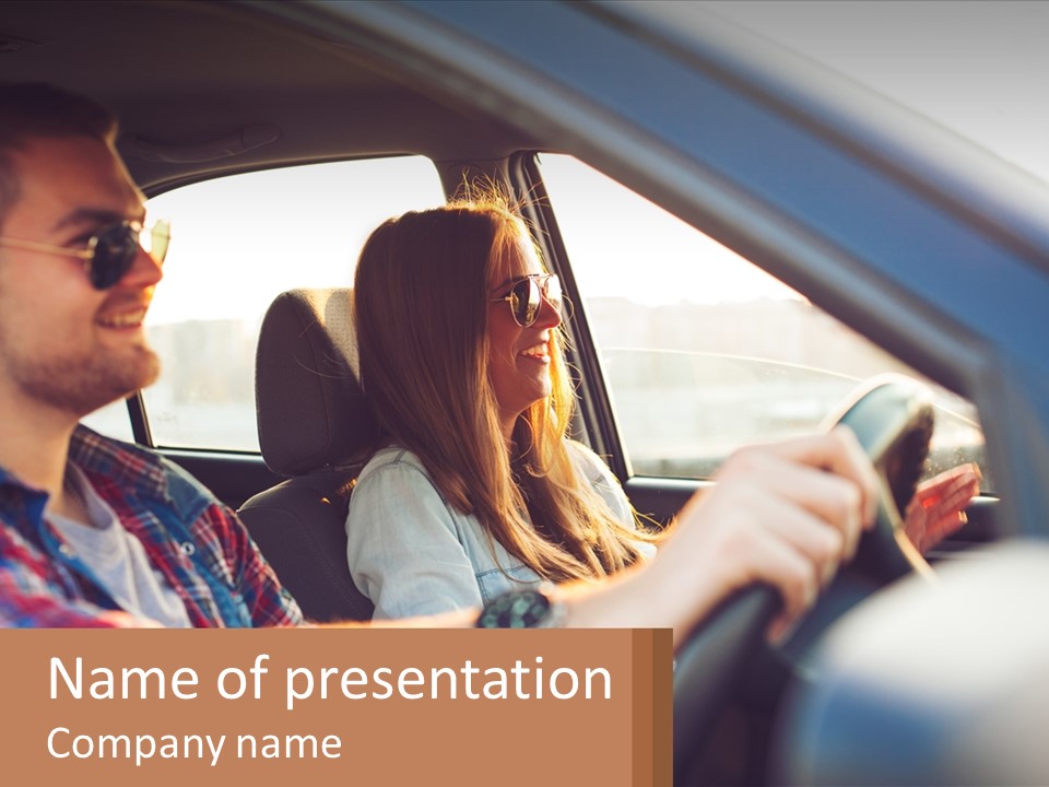 A Man And A Woman Sitting In A Car PowerPoint Template