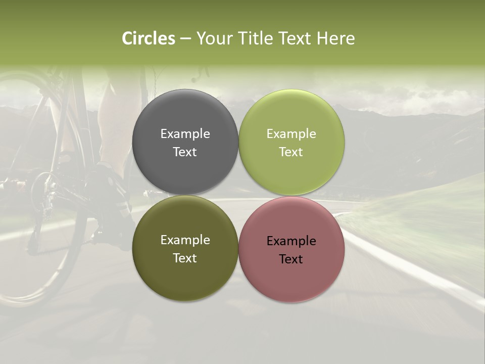 A Person Riding A Bike On A Road With Mountains In The Background PowerPoint Template