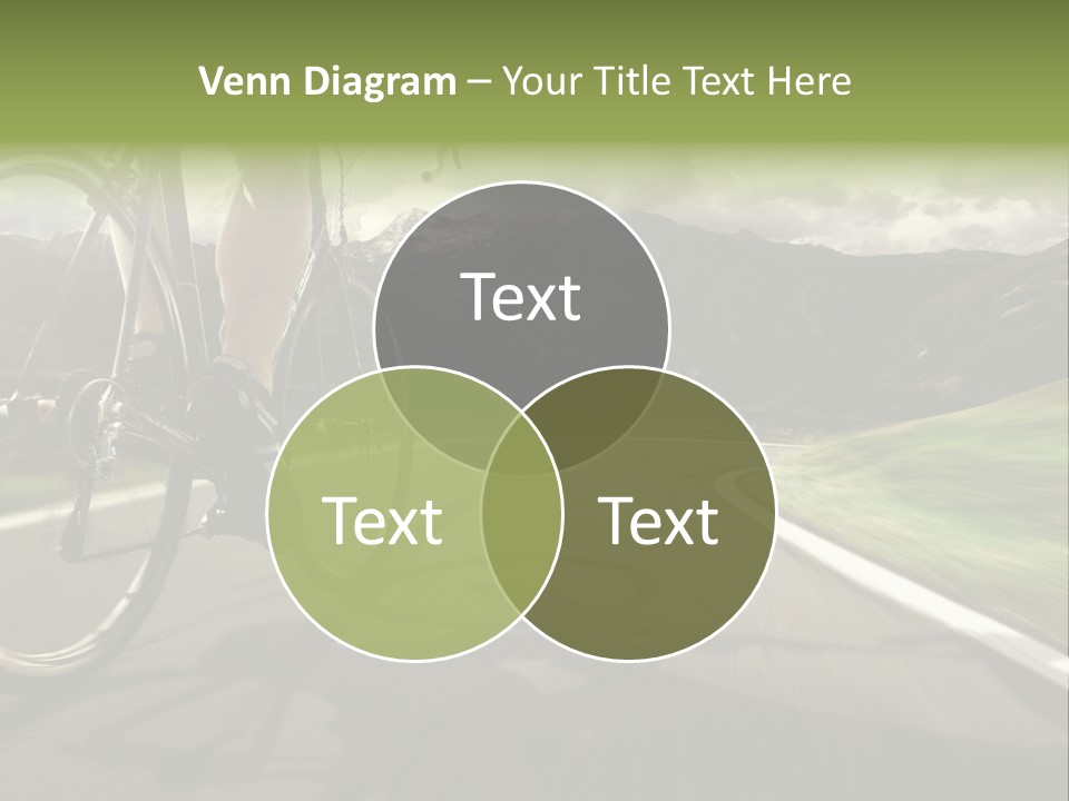 A Person Riding A Bike On A Road With Mountains In The Background PowerPoint Template