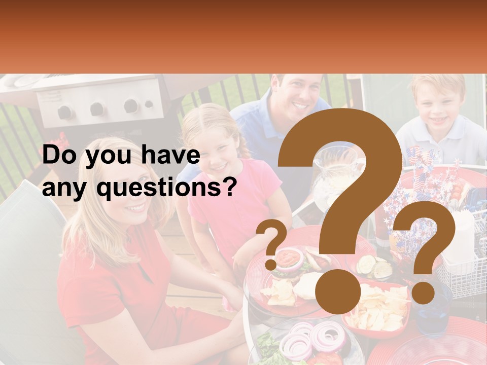 A Group Of People Sitting Around A Table With Food PowerPoint Template