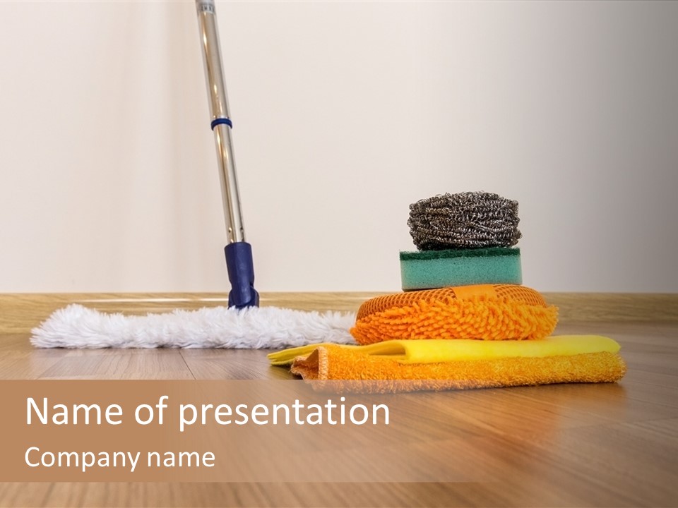 A Mop And Cleaning Supplies On A Wooden Floor PowerPoint Template