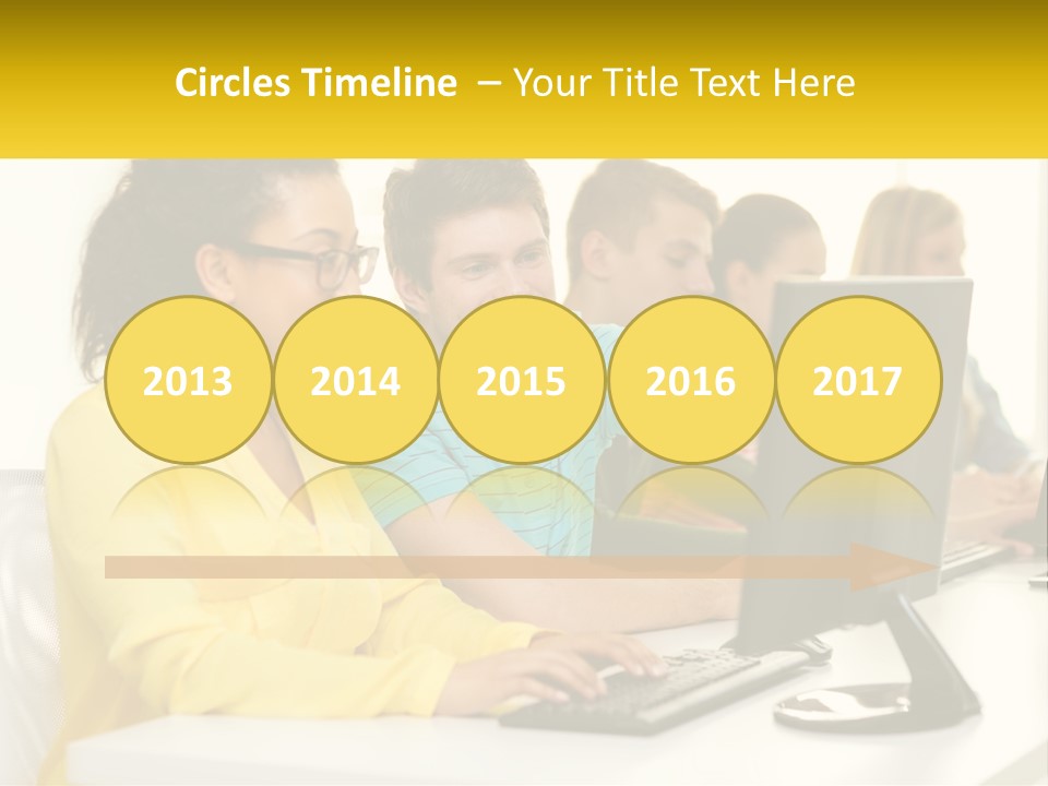 A Group Of People Sitting Around A Computer PowerPoint Template