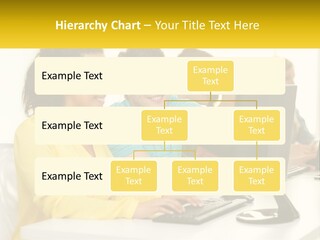 A Group Of People Sitting Around A Computer PowerPoint Template