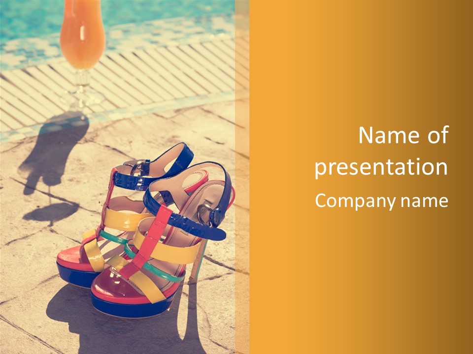 A Woman's Colorful High Heeled Shoes On A Sidewalk Next To A Pool PowerPoint Template