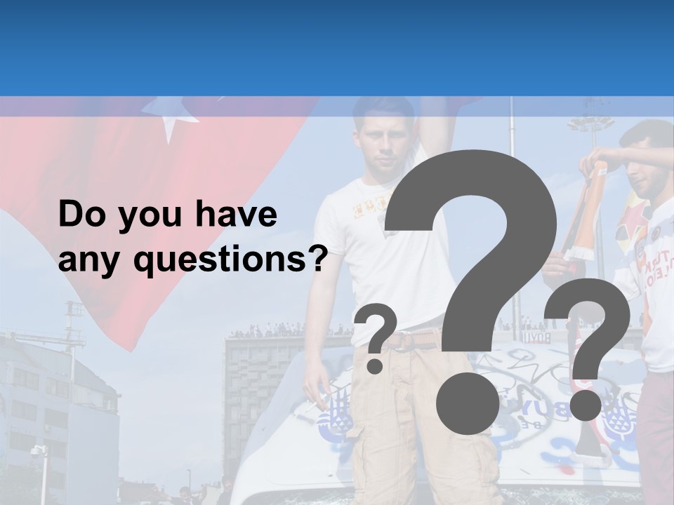 A Man Holding A Flag Standing On Top Of A Car PowerPoint Template