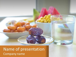 A Table Topped With A Bowl Of Fruit And A Glass Of Water PowerPoint Template