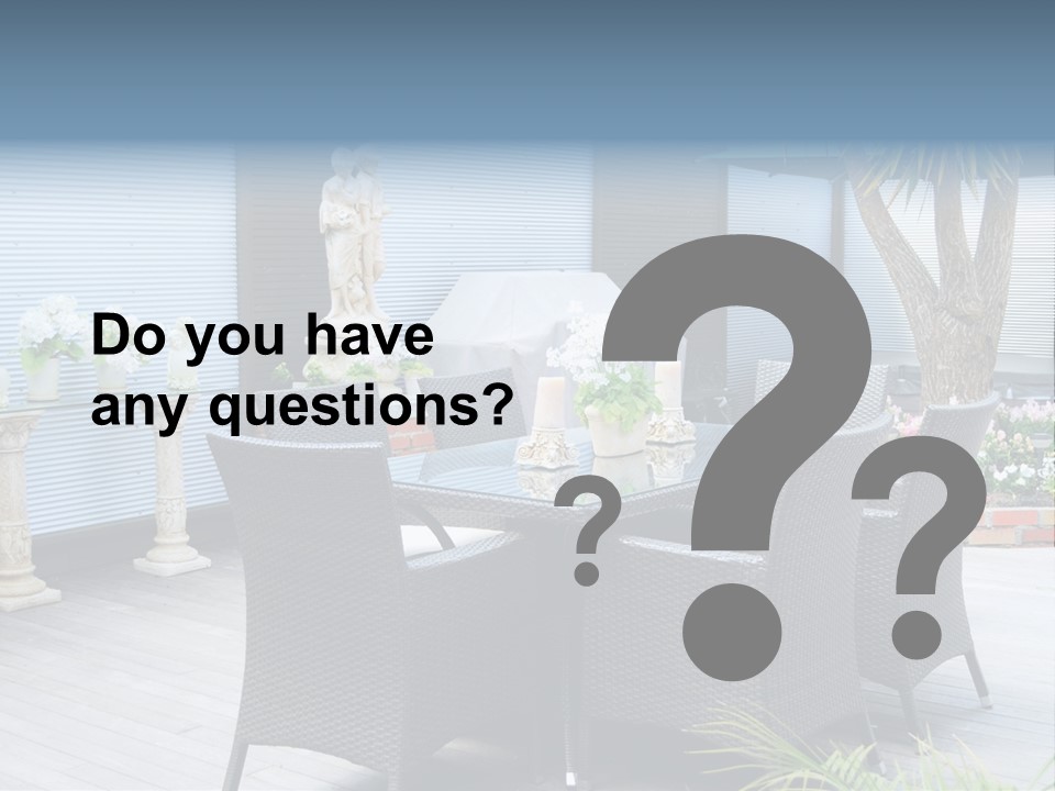A Table And Chairs On A Patio With A Statue In The Background PowerPoint Template