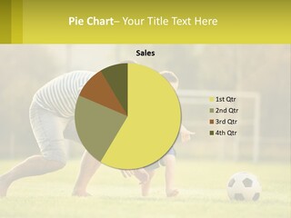 A Father And Son Playing Soccer On A Field PowerPoint Template