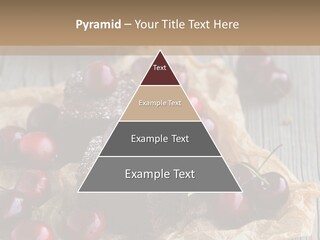 A Piece Of Cake With Cherries And A Cup Of Tea On A Wooden Table PowerPoint Template