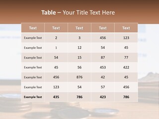 A Pile Of Coins Sitting On Top Of A Wooden Table PowerPoint Template