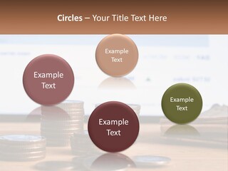 A Pile Of Coins Sitting On Top Of A Wooden Table PowerPoint Template