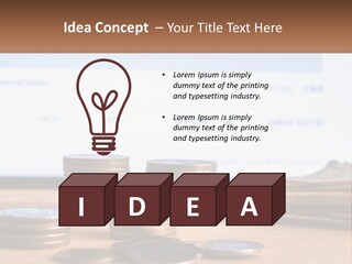 A Pile Of Coins Sitting On Top Of A Wooden Table PowerPoint Template