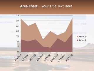 A Pile Of Coins Sitting On Top Of A Wooden Table PowerPoint Template