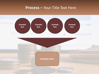 A Pile Of Coins Sitting On Top Of A Wooden Table PowerPoint Template