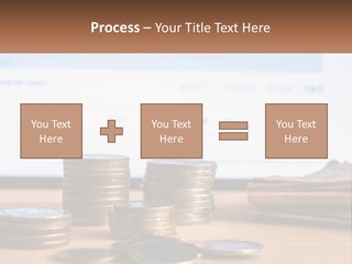A Pile Of Coins Sitting On Top Of A Wooden Table PowerPoint Template