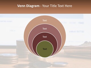 A Pile Of Coins Sitting On Top Of A Wooden Table PowerPoint Template