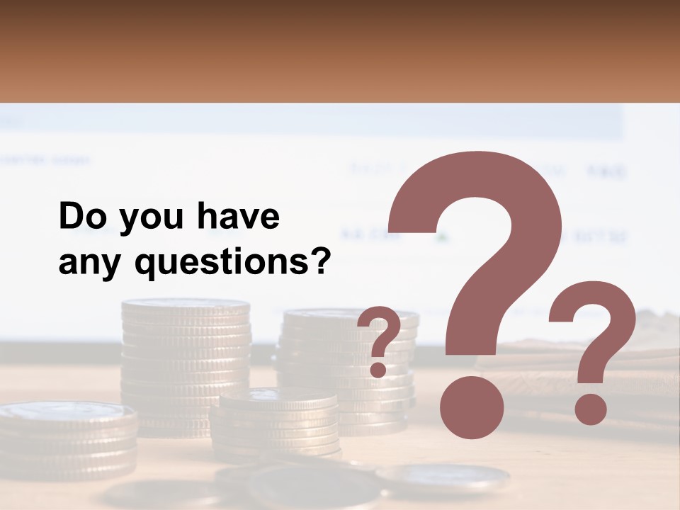 A Pile Of Coins Sitting On Top Of A Wooden Table PowerPoint Template