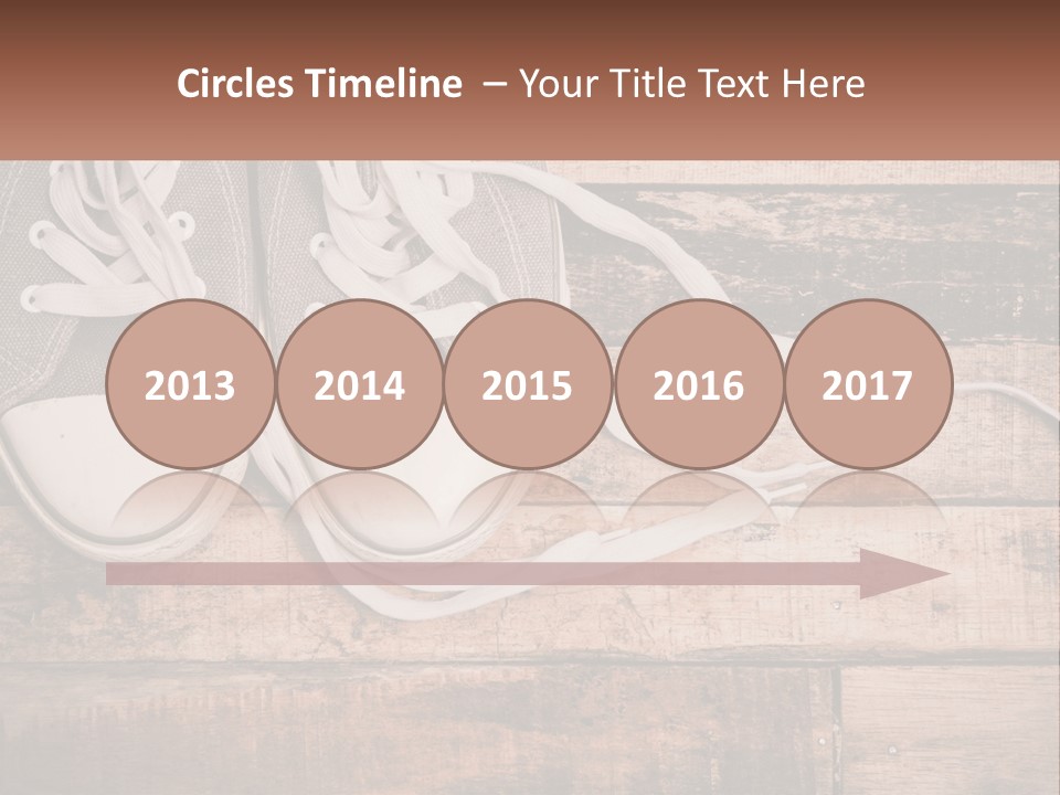 A Pair Of Gray Sneakers On A Wooden Floor PowerPoint Template