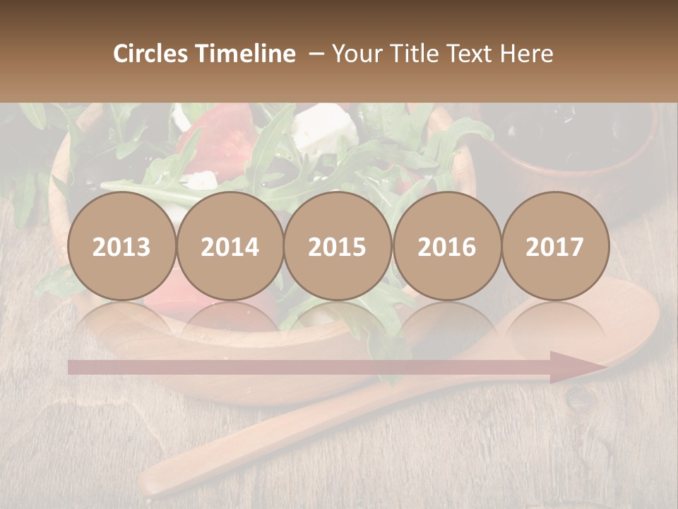A Wooden Bowl Filled With A Salad Next To A Wooden Spoon PowerPoint Template