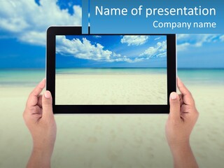 A Person Holding A Tablet With A Beach In The Background PowerPoint Template