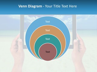 A Person Holding A Tablet With A Beach In The Background PowerPoint Template