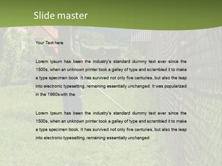A Man Is Mowing The Grass With A Lawn Mower PowerPoint Template