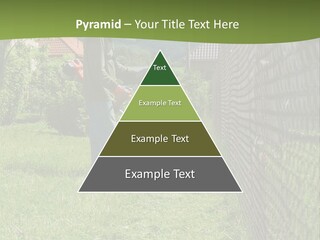 A Man Is Mowing The Grass With A Lawn Mower PowerPoint Template