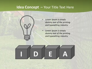 A Man Is Mowing The Grass With A Lawn Mower PowerPoint Template
