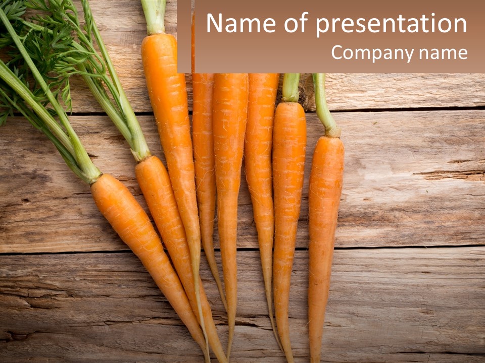A Bunch Of Carrots On A Wooden Table PowerPoint Template